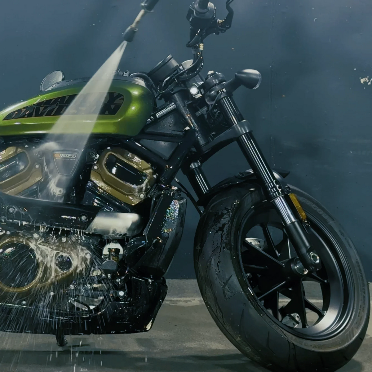 How do you properly care for a motorcycle without damaging sensitive components?